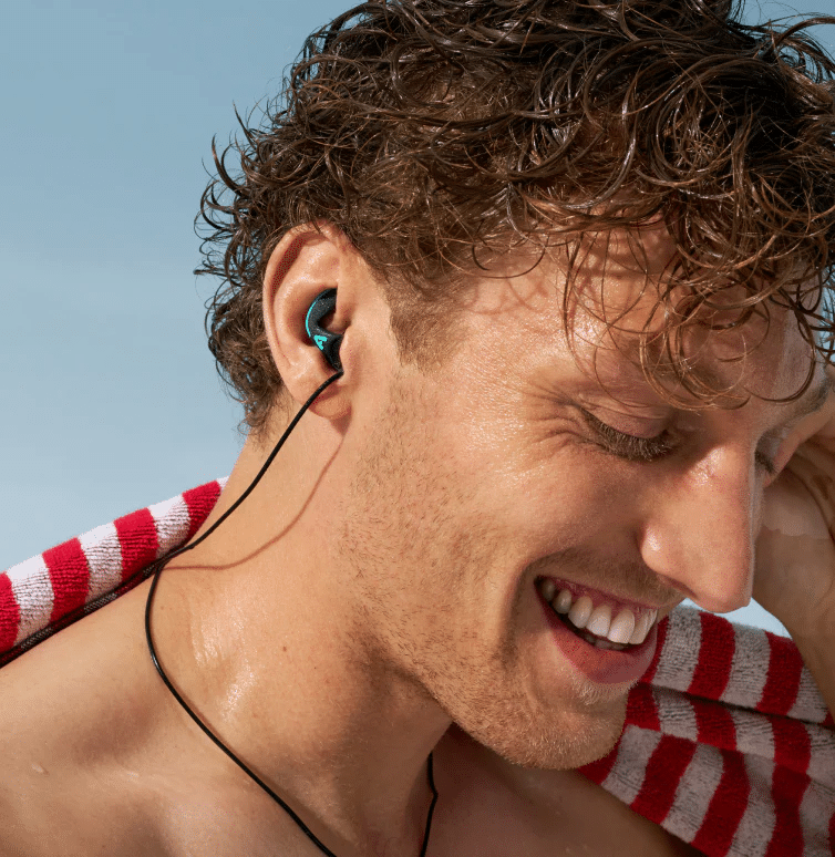 Young man wearing Alpine Hearing Protection.